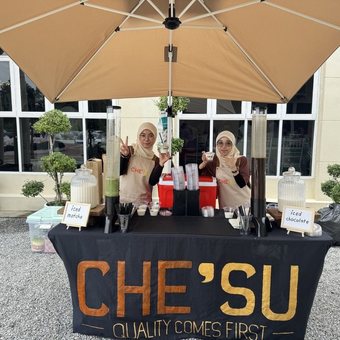 CHE'SU booth serving drinks at an event